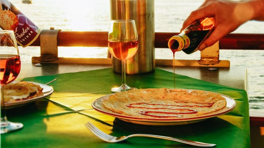 Amsterdam: River Cruise With All-You-Can-Eat Dutch Pancakes - Boarding and settling at your table