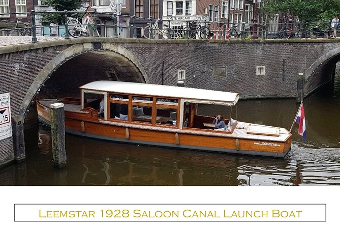 Amsterdam small-group canal cruise in 1920s saloon boat - The grand curve of Herengracht