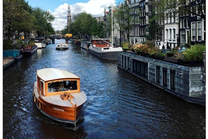 Amsterdam small-group canal cruise in 1920s saloon boat - Reguliersgracht and the smaller waterways