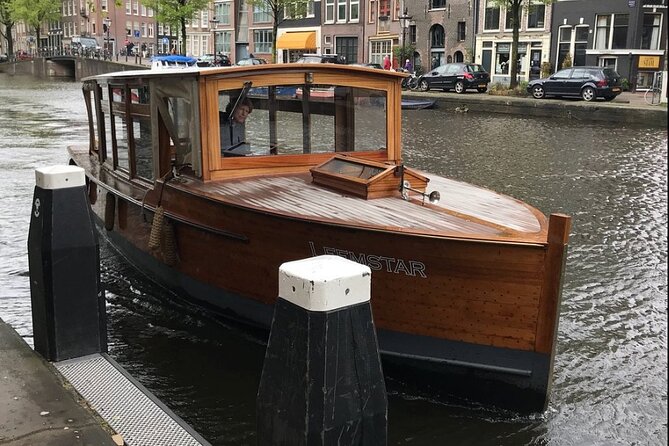 Amsterdam small-group canal cruise in 1920s saloon boat - Reaching the Magere Brug