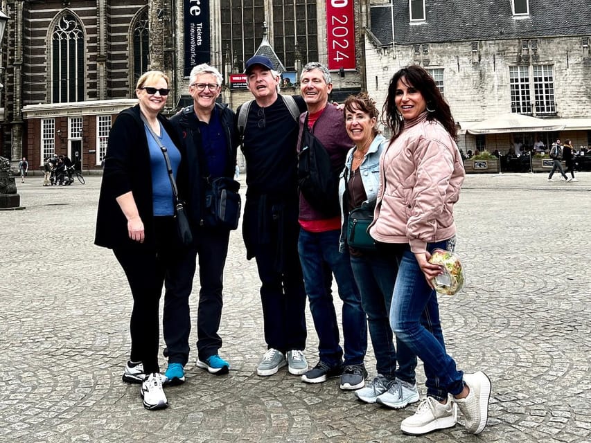 Amsterdam: Small Group Walking Tour with Fun Guide - Canals, canal houses, and photographic pauses