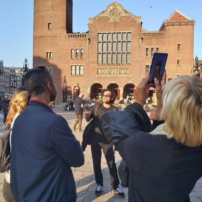 Amsterdam: Spanish Tour Unmasking the Redlight District - Zeedijk and the city’s seafaring past