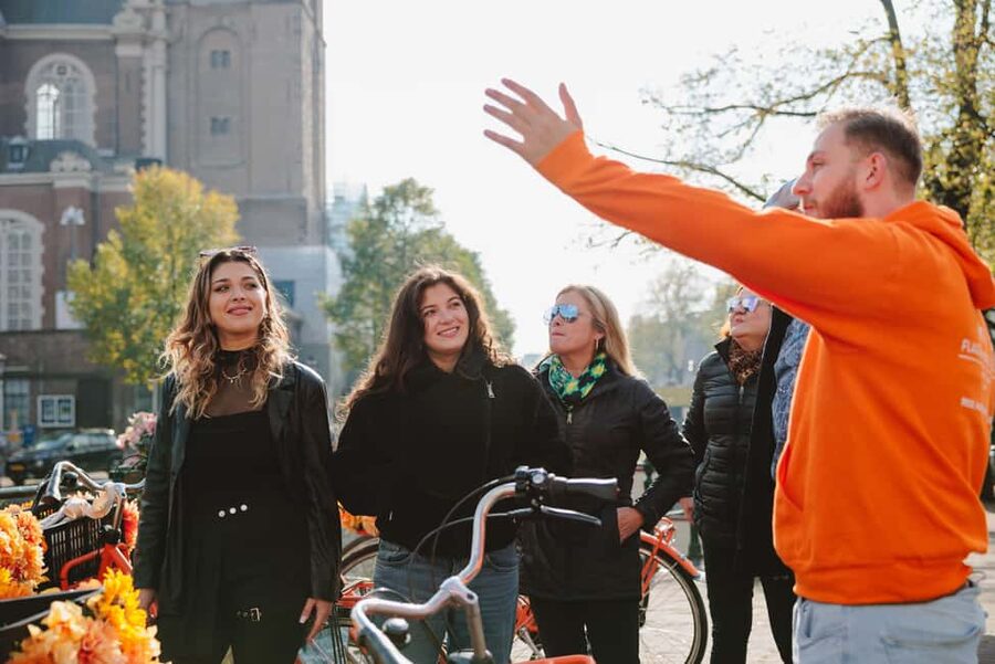 Amsterdam: Top Highlights Guided Bike Tour EN/DE/ES/FR/IT/CN - Passing the Red Light District and reaching Leidse Square