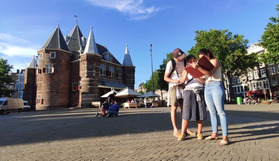 Amsterdam: Treasure Hunt Walking Tour "A Secret Sender" - Nieuwmarkt Square sets the case in motion