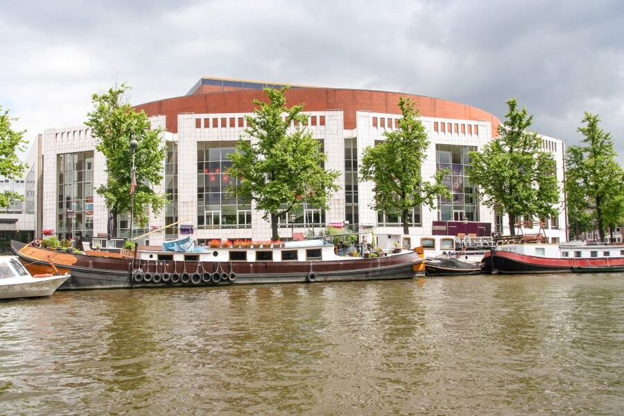 Amsterdam Walking Tour and Canal Cruise - Seeing Amsterdam from a glass-roofed boat