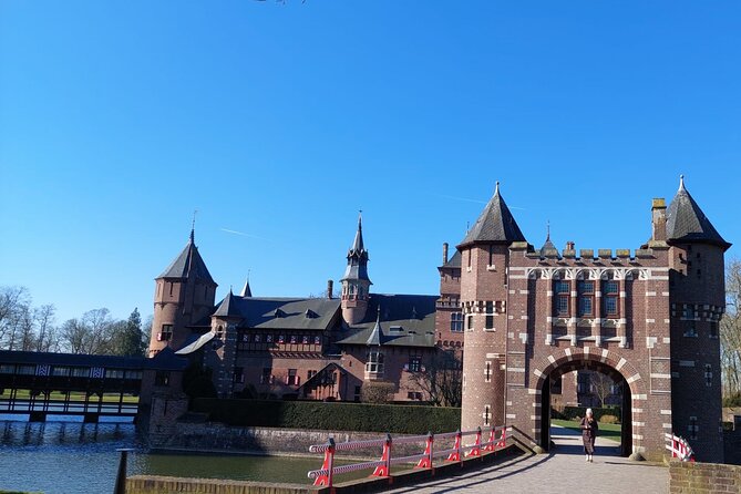 Castle De Haar Small-Group Tour from Amsterdam - Entering the castle with a guide