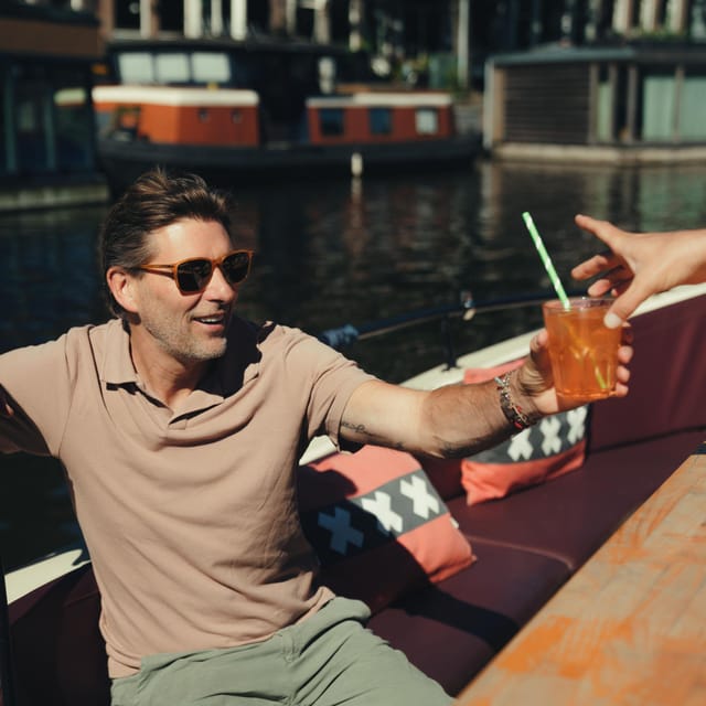 COZY AND FUN CANAL TOUR: A UNIQUE JOURNEY THROUGH AMSTERDAM - Stopera and the turn toward Herengracht