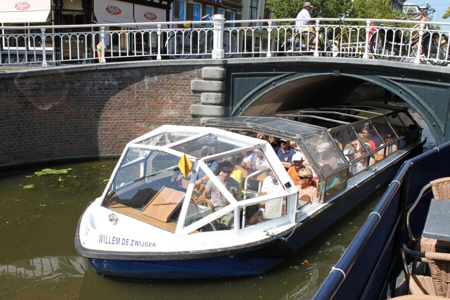 Delft: Canal Cruise with Guided Commentary - Passing under Delft’s narrow bridges