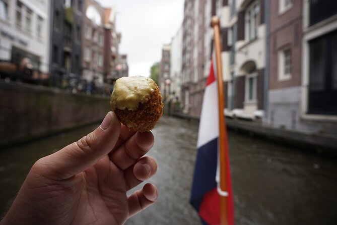 Eating Amsterdam: Food Tour & Canals Cruise - One hour on a vintage wooden saloon boat