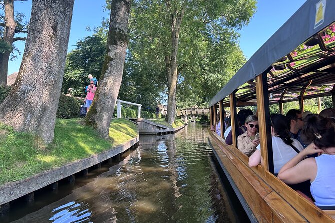 From Amsterdam: Giethoorn Day Trip with Canal & Village Tour - Arriving in Giethoorn by boat