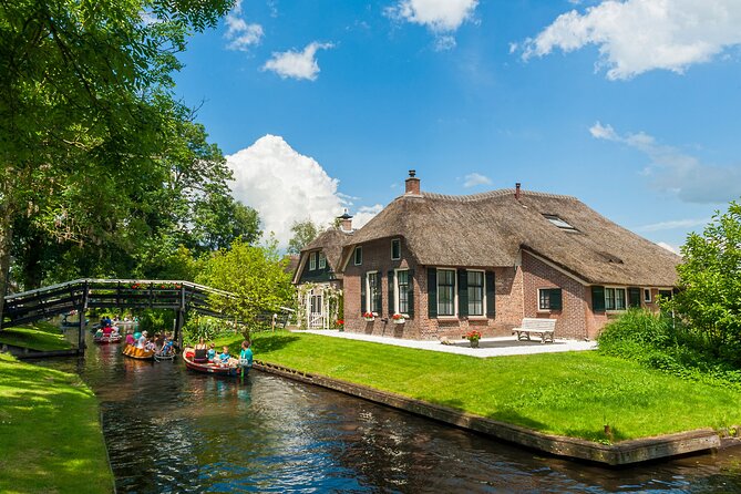Giethoorn Day Trip from Amsterdam With Cruise and Cheeseplatter - The one-hour canal cruise with cheese tasting