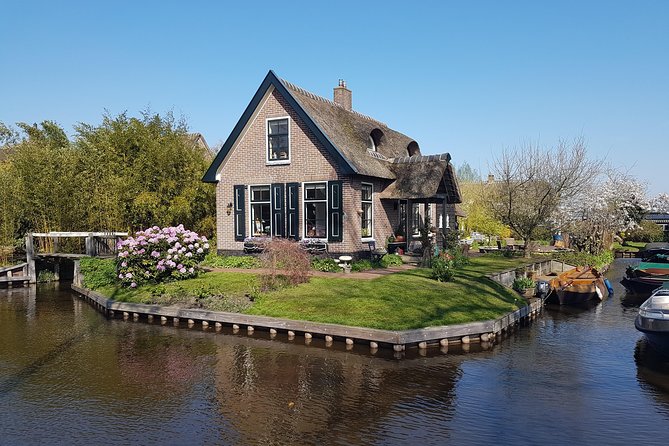 Giethoorn Small-Group Tour from Amsterdam (Max. 8 People) - Giethoorn by small boat before the crowds