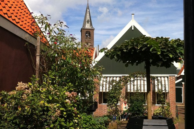 Half-Day Edam and Volendam Private Walking Tour from Amsterdam - Edam’s Canals, Wooden Houses, and Quiet Courtyards