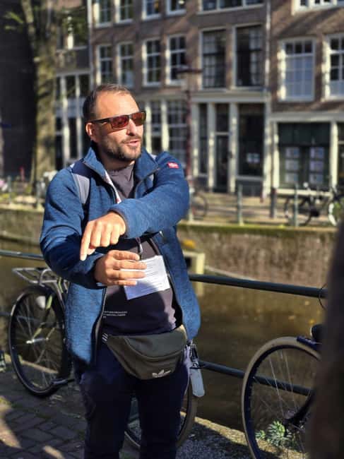 Liberal Amsterdam: Small-Group Walking Tour & Anne Frank VR - Bridges, leaning houses, and life on the water