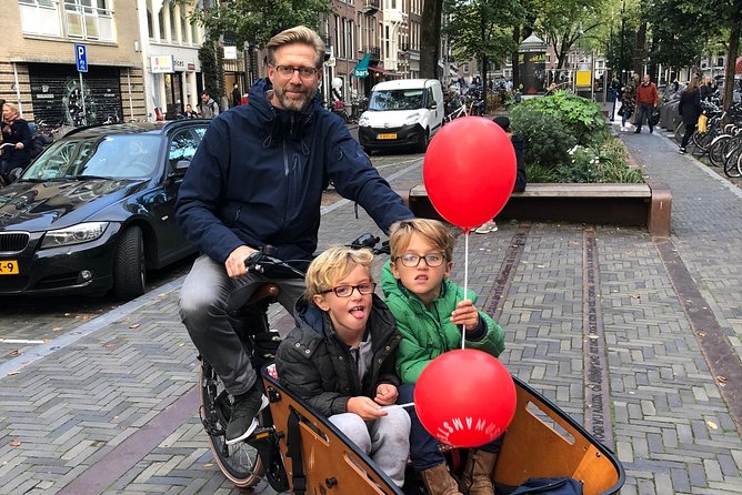 Private Amsterdam Bike Tour with a local guide (also for families) - Dam Square and Damstraat: where Amsterdam begins