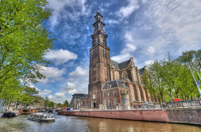 Private boat tour on a electric saloon boat - A quiet way into Amsterdam’s Canal Ring