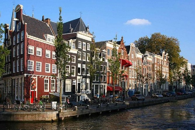 Secrets of Amsterdam Walking Tour plus Dutch Sweets Tasting - Bloemenmarkt and Amsterdam’s floating flower tradition