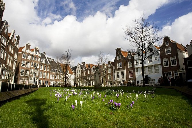 Secrets of Amsterdam Walking Tour plus Dutch Sweets Tasting - Munt Tower and the practical story of the city