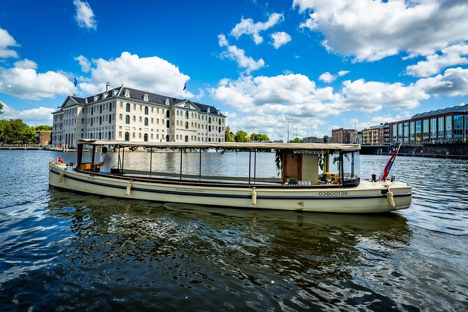 Small-Group Luxury Canal Cruise with Local Skipper - Crooked houses near the Amstel