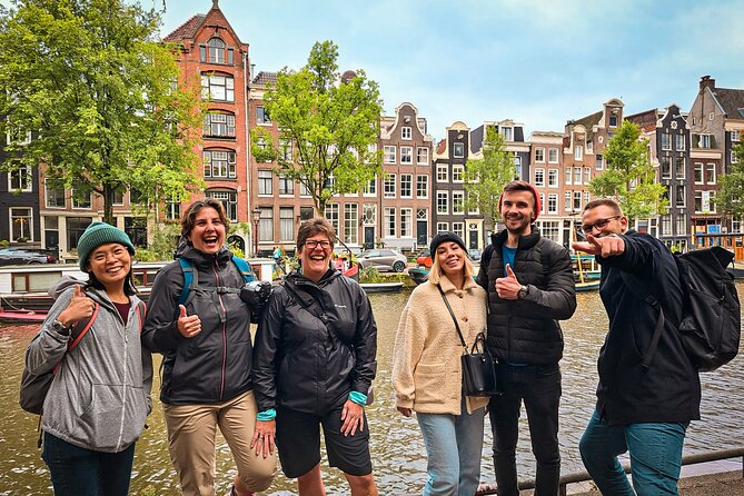 Small Group Walking Tour - Hello Amsterdam - Damrak: dancing houses and a true-or-false game