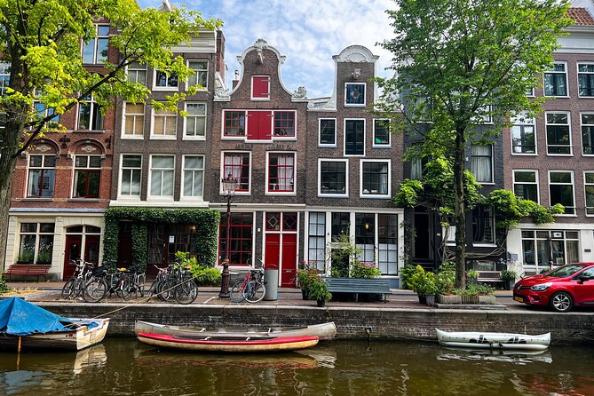 Small Group Walking Tour in Amsterdam with Friendly and Fun Guide - The canals: one hour of city planning and trade