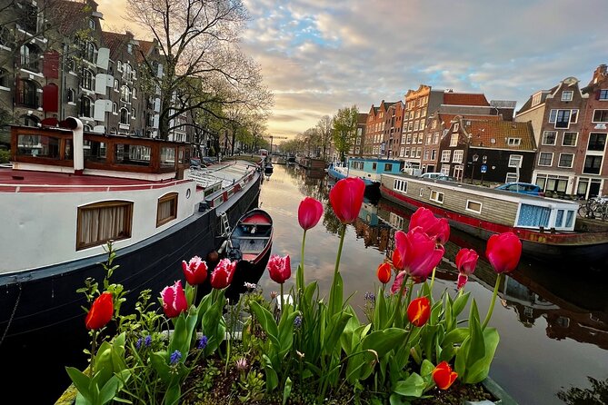 Small Group Walking Tour in Amsterdam with Friendly and Fun Guide - Jordaan: from canal workers to village-like streets