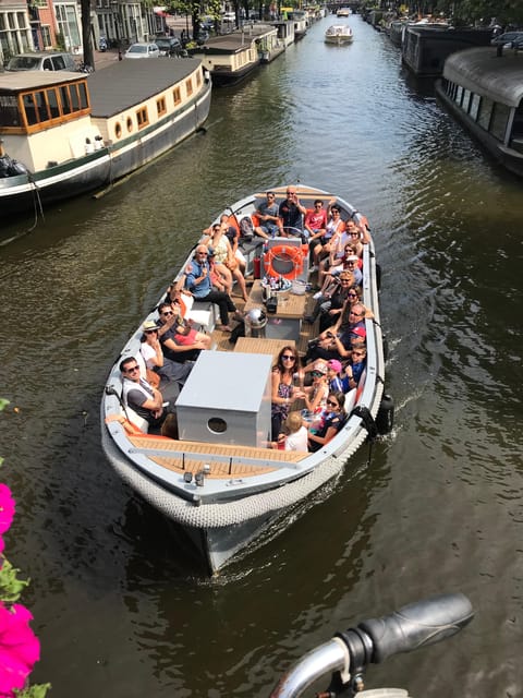 Visit Amsterdam by Boat with a French Guide (french) - Why a small electric boat changes the Amsterdam canal ride