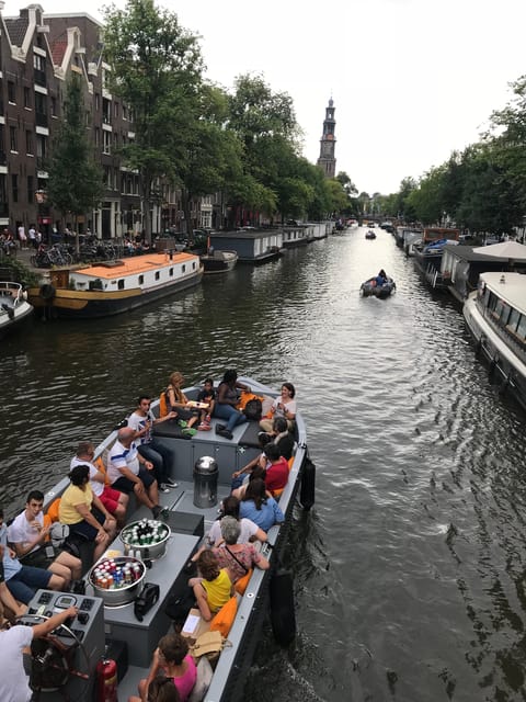 Visit Amsterdam by Boat with a French Guide (french) - A French aperitif with Gouda and local stories