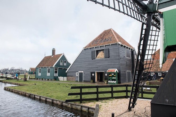 Visit Amsterdam Countryside with windmills by bike - Riding through wet meadows and old water country