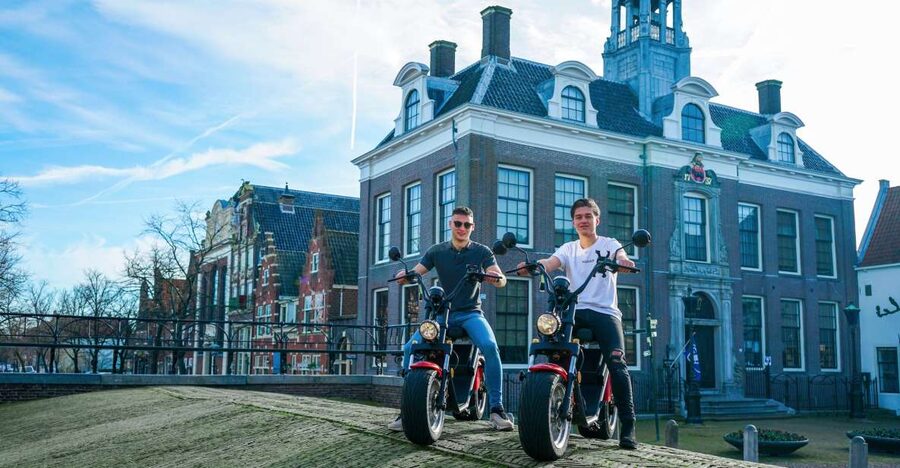 Volendam: E-Scooter Rental - Monnickendam: brick houses and a working harbor
