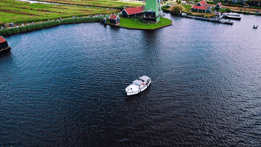 Zaanse Schans: Private Cruise + Live Guide, Optional Drinks - From painted mills to cocoa and factory buildings