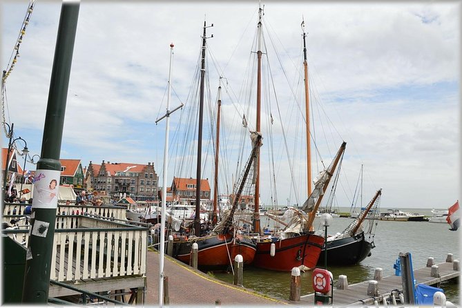 Zaanse Schans Windmills, cheese and clogs and Volendam tour from Amsterdam - Volendam harbor, seafood, and Dutch sweets